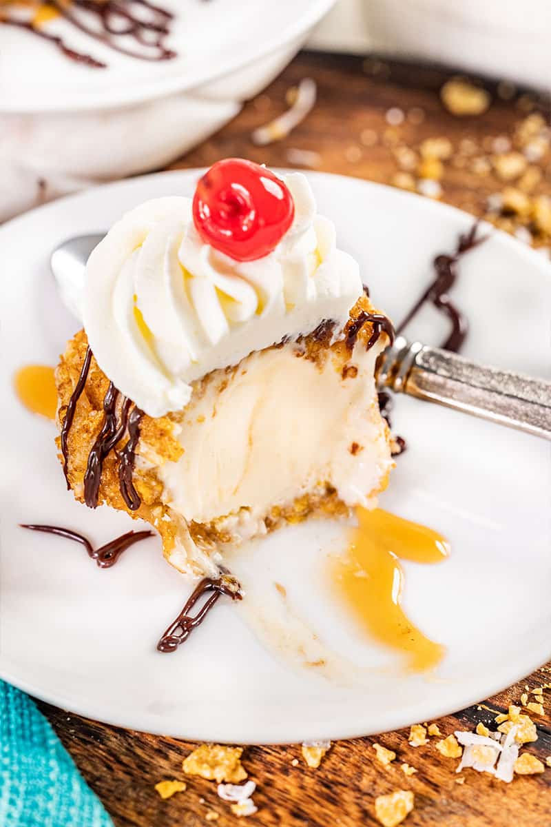 Fried ice cream with whipped cream and a cherry on top.