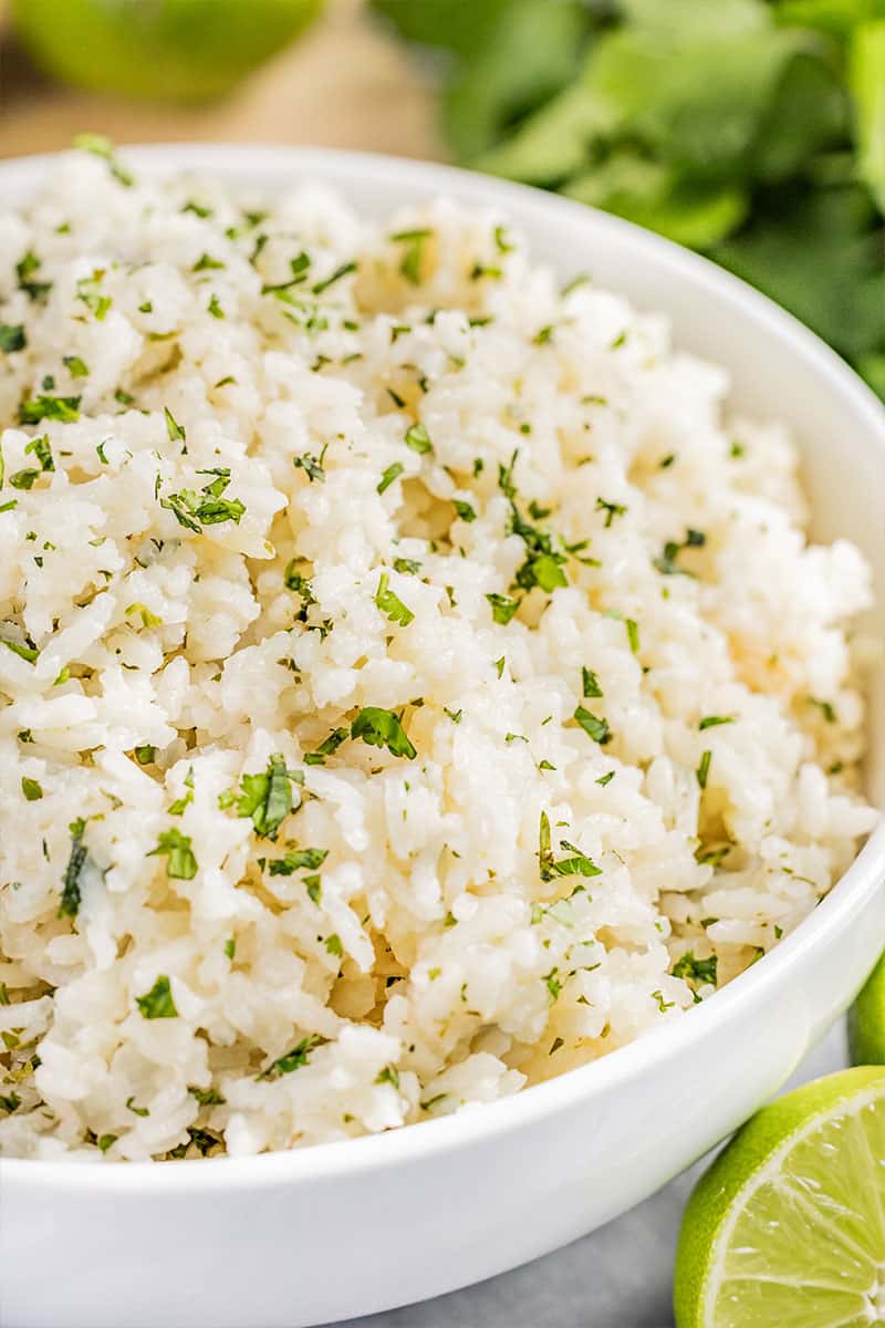 Cilantro lime rice pilaf in a white bowl.