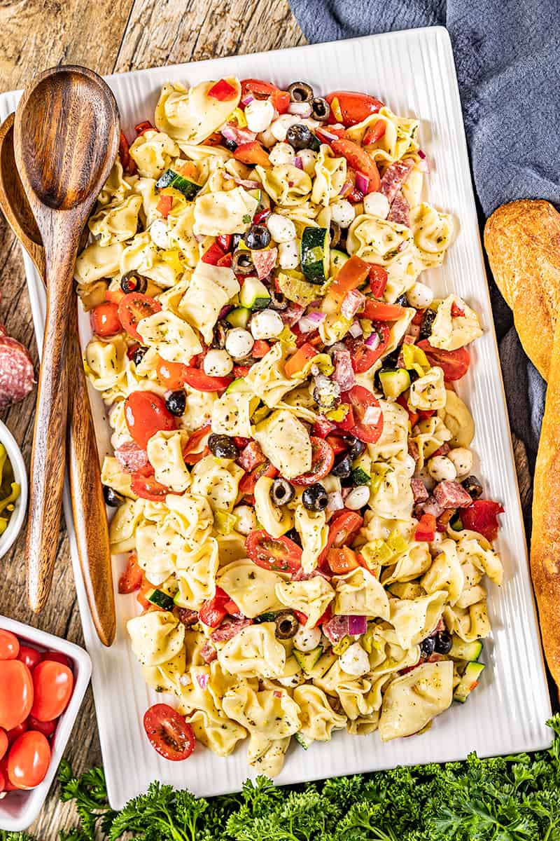 Overhead view of a serving platter filled with tortellini pasta salad.