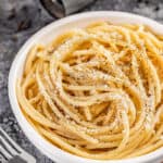 Cacio e Pepe with parmesan cheese on top.