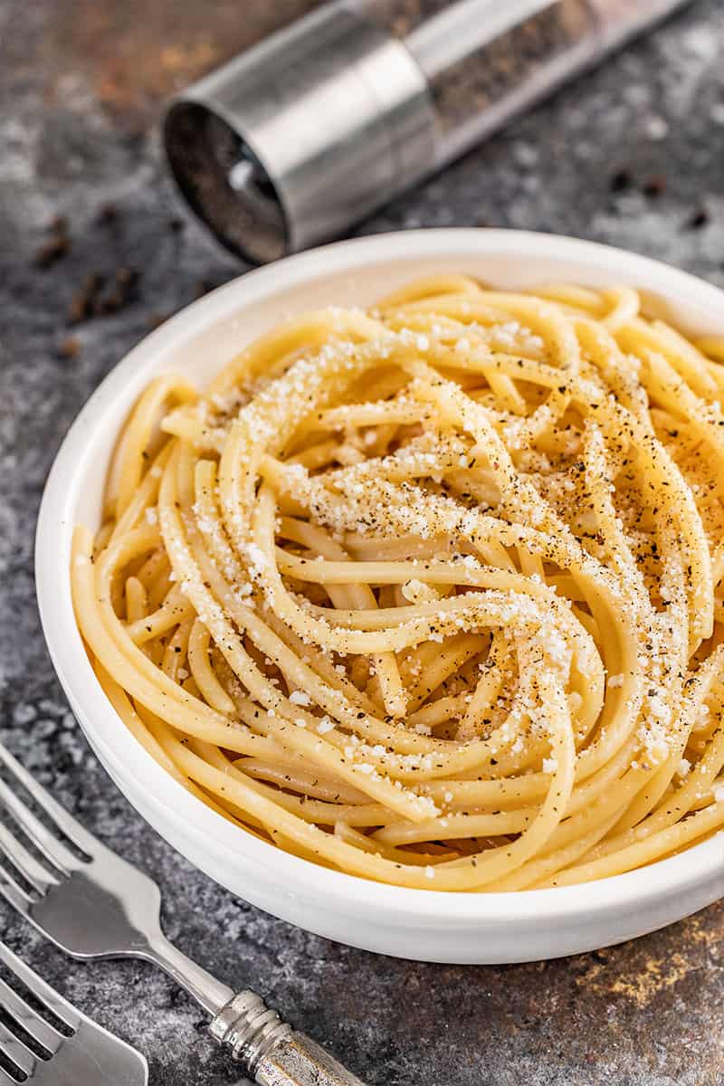 Cacio e Pepe with parmesan cheese on top.