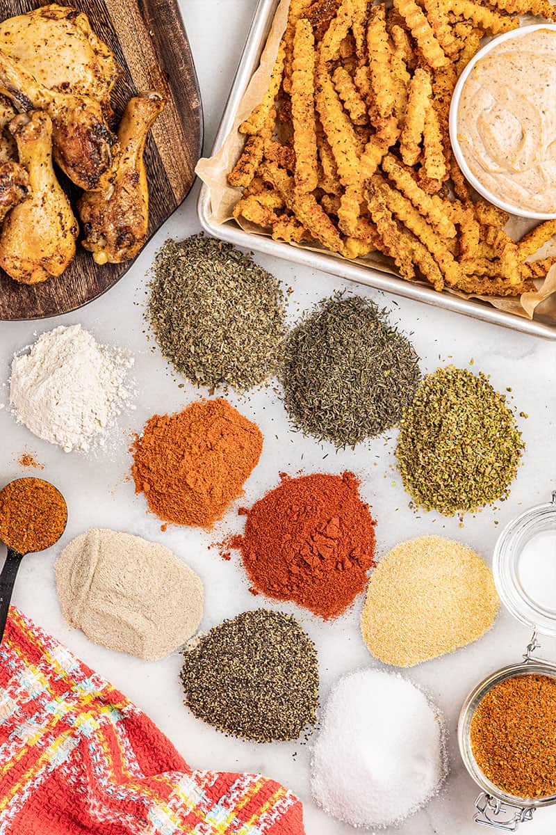 Overhead view of the different spices that go into homemade cajun seasoning.