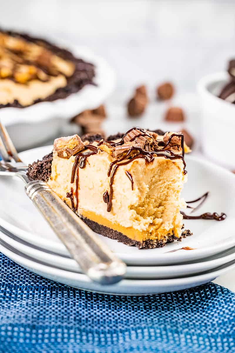 A slice of peanut butter pie with a bite removed.