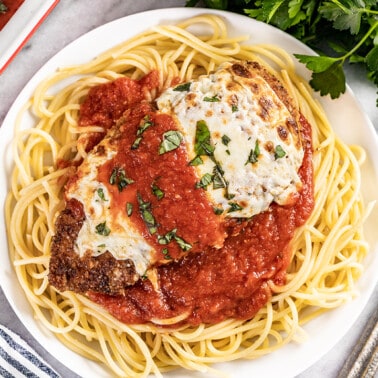Overhead view of a plate of chicken parmesan.