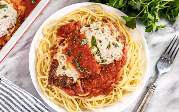 Overhead view of a plate of chicken parmesan.
