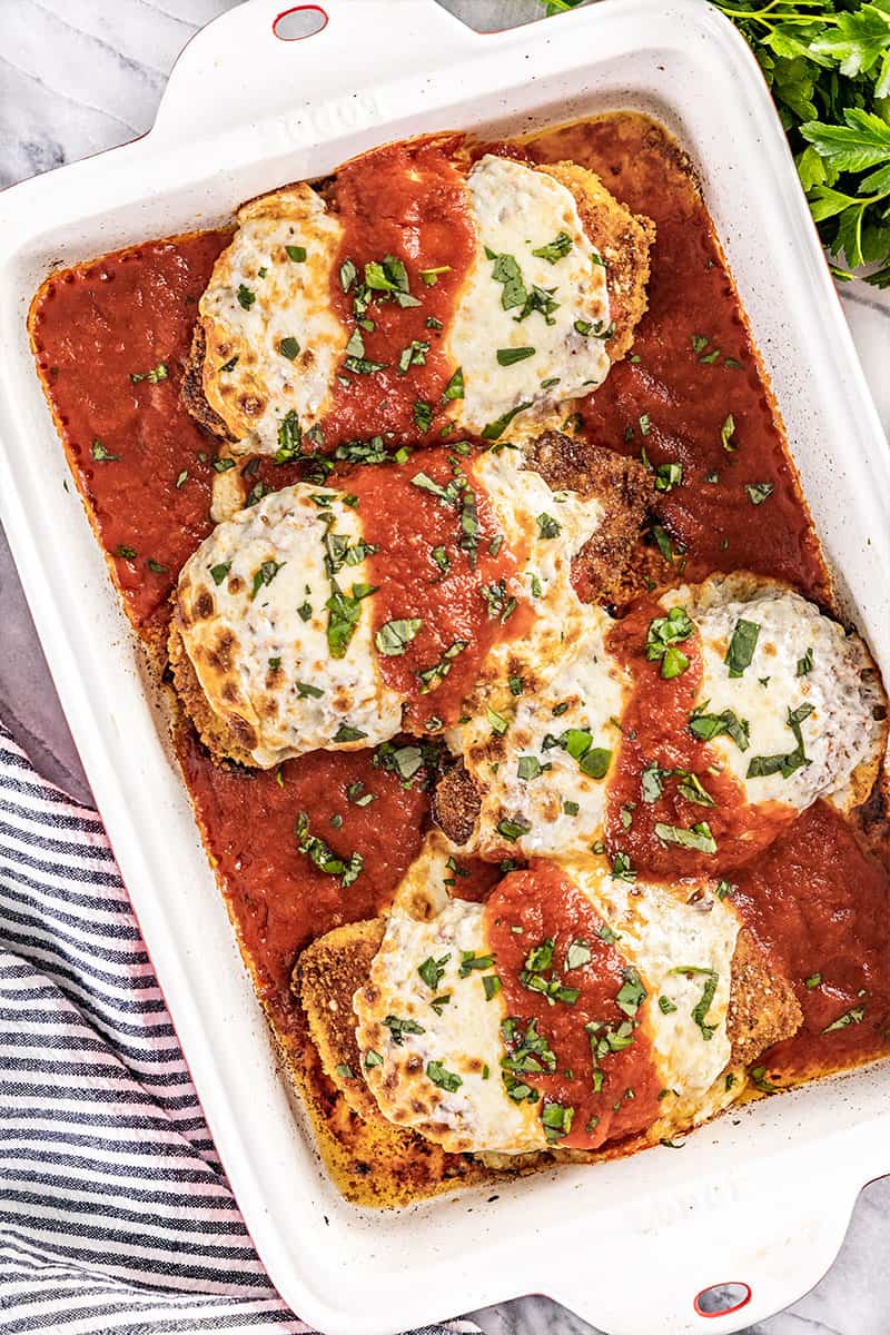 Overhead view of a baking dish filled with chicken parmesan.