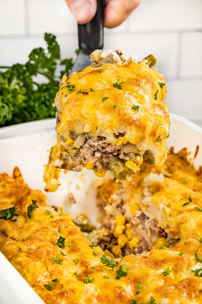 Tater tot casserole on a spatula.