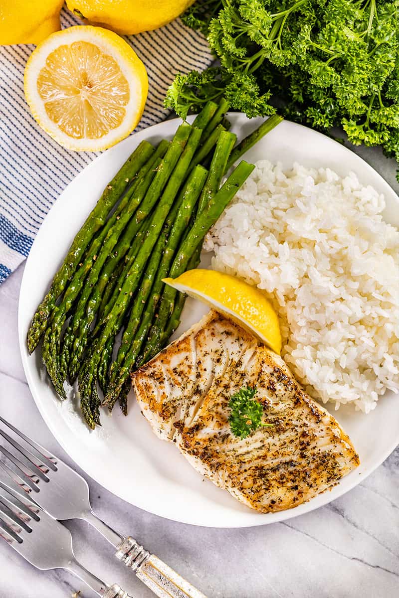 Overhead view of a plate with pan seared fish.