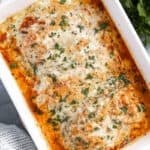 A baking dish filled with lasagna stuffed chicken breasts.