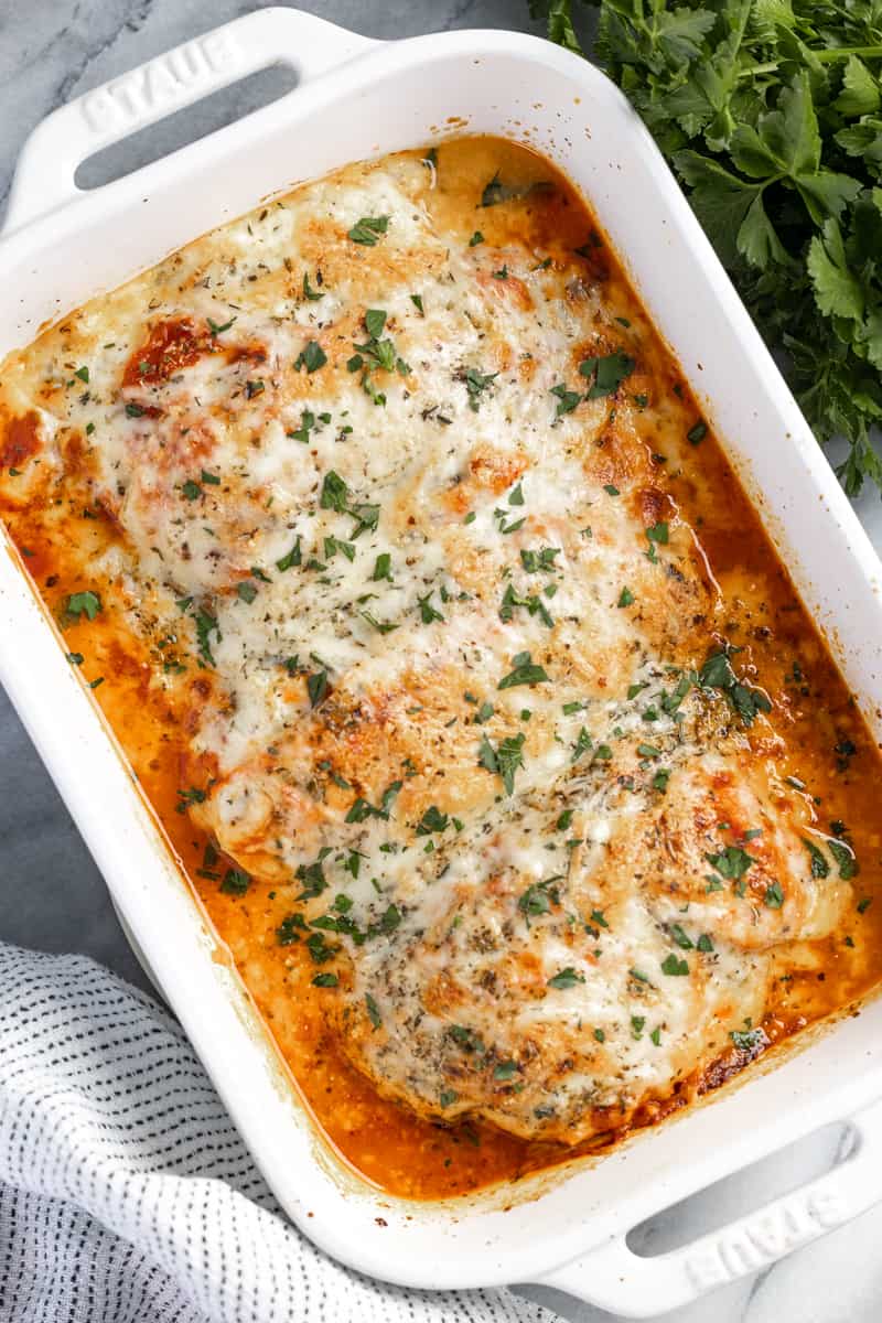 A baking dish filled with lasagna stuffed chicken breasts.