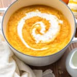 A bowl filled with creamy pumpkin soup.