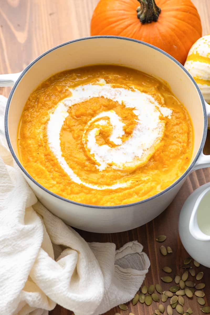 A bowl filled with creamy pumpkin soup.