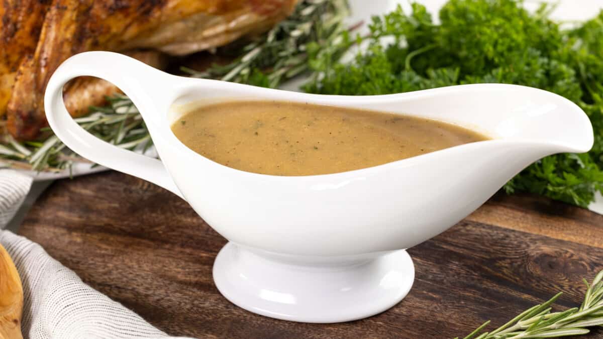 Turkey gravy in a white gravy boat.