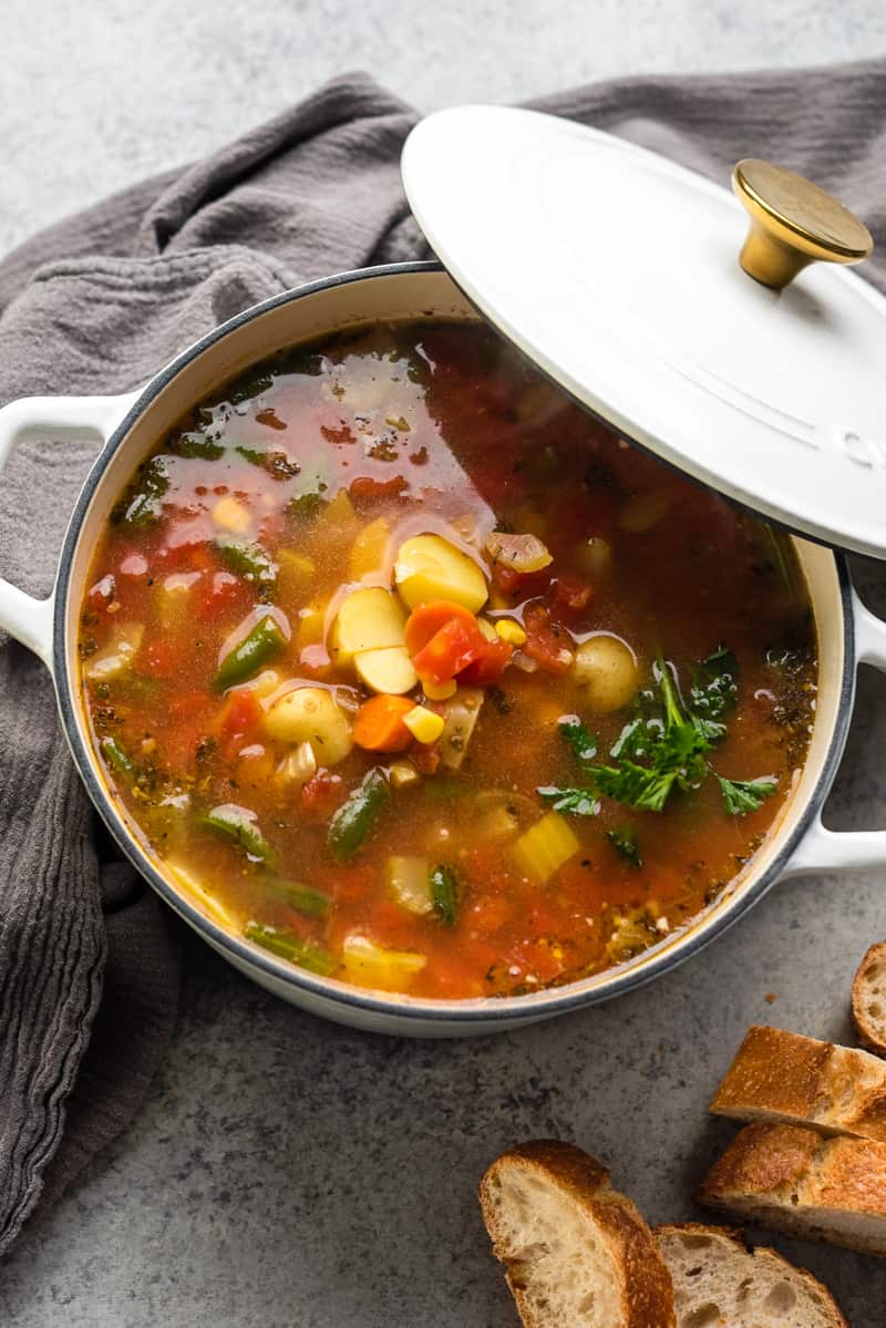 Overhead view of vegetable soup in a pot.