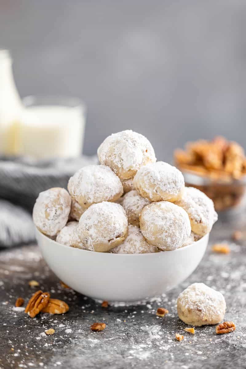 A bowl filled with pecan sandies.