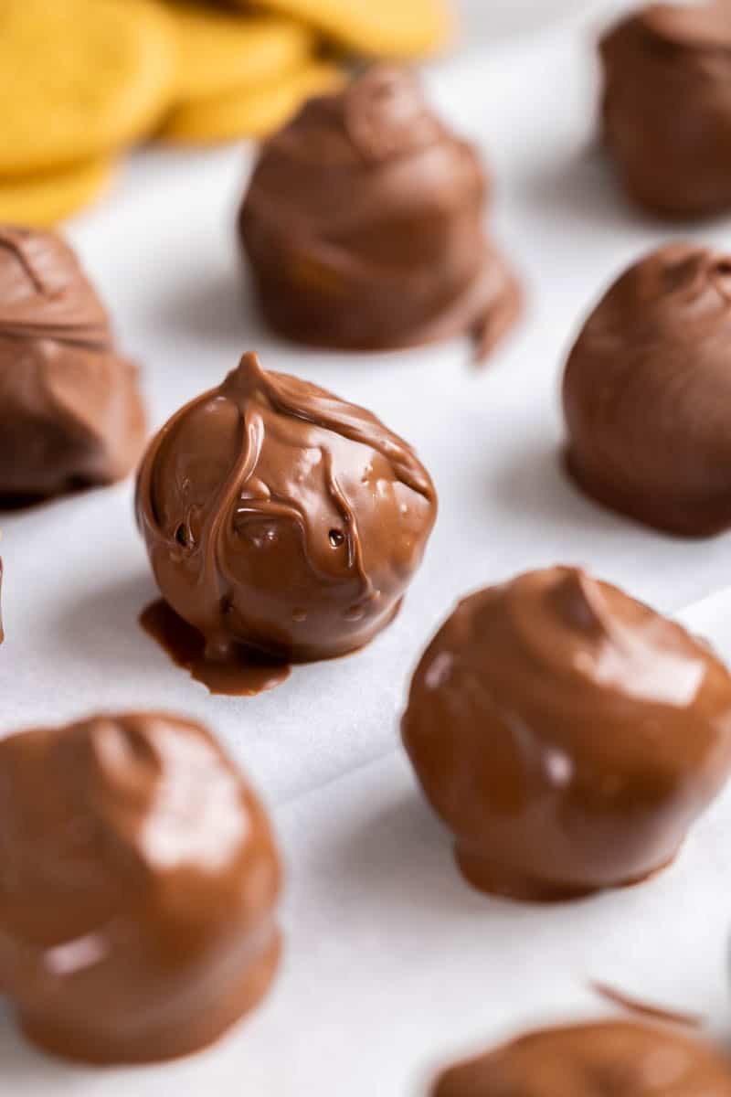 Close up view of gingersnap truffles on a baking sheet.