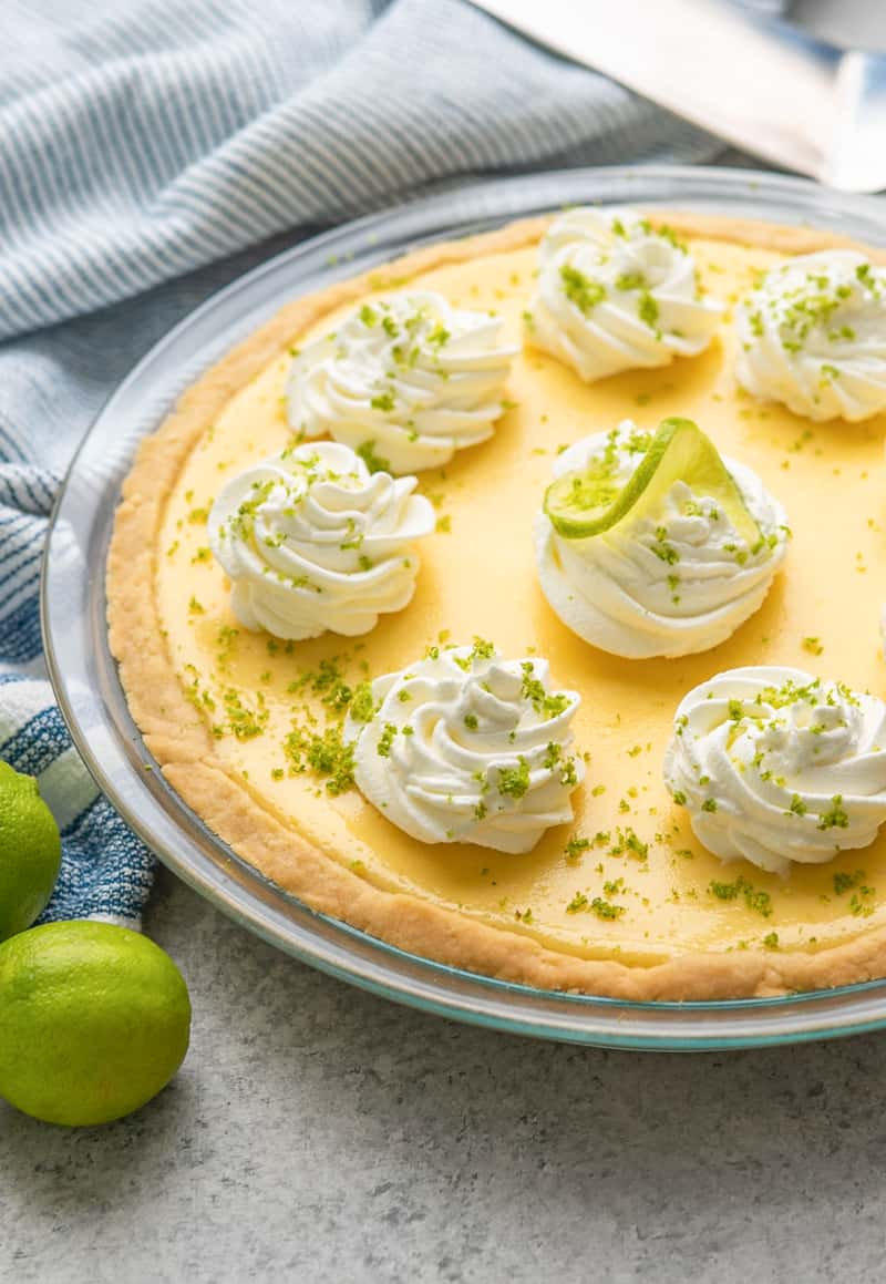 A whole key lime pie in a pie plate.