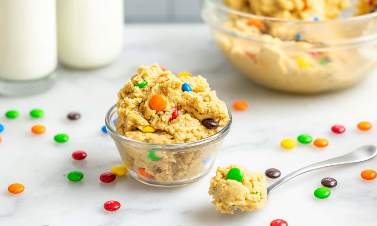 A small glass bowl filled with M&M cookie dough.