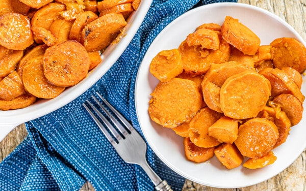 Overhead view of candied yams on a plate.
