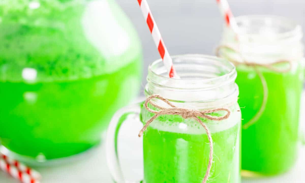 Close up view of Grinch punch in glass cups.
