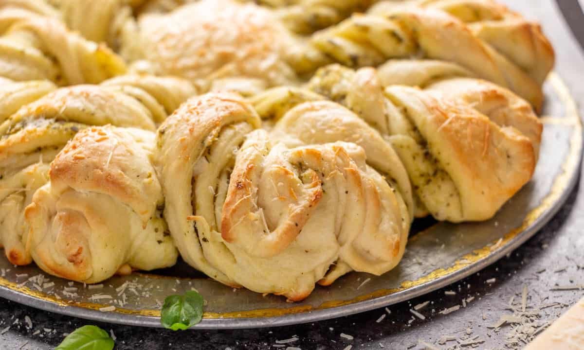 Close up image of the sides of a loaf of pesto parmesan star bread.