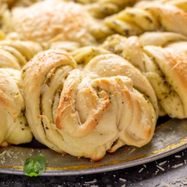Close up image of the sides of a loaf of pesto parmesan star bread.
