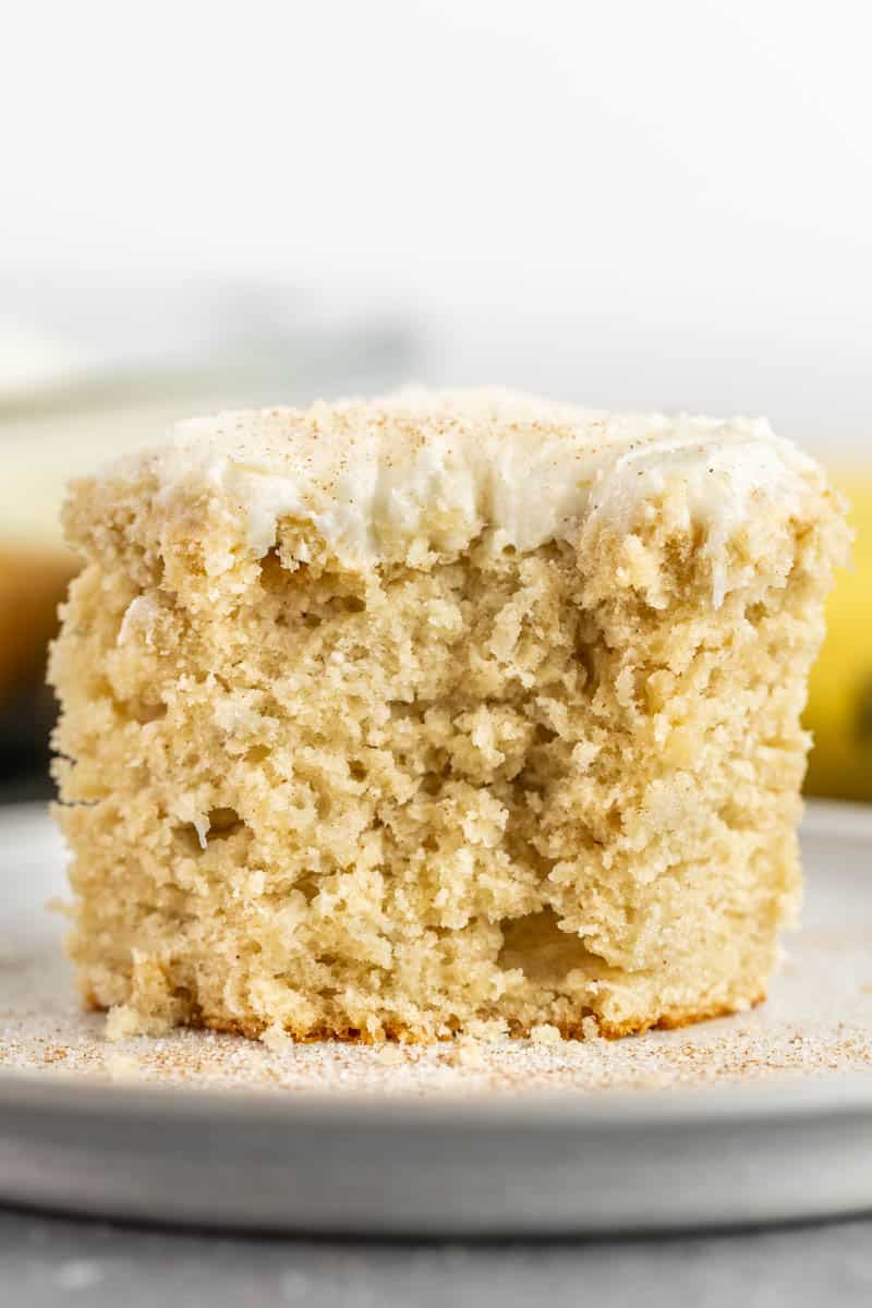 Banana cake with a bite removed on a plate.