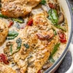 Creamy Tuscan chicken in a pot.