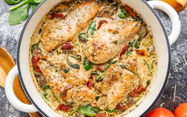 Overhead view of creamy tuscan chicken in a pot.