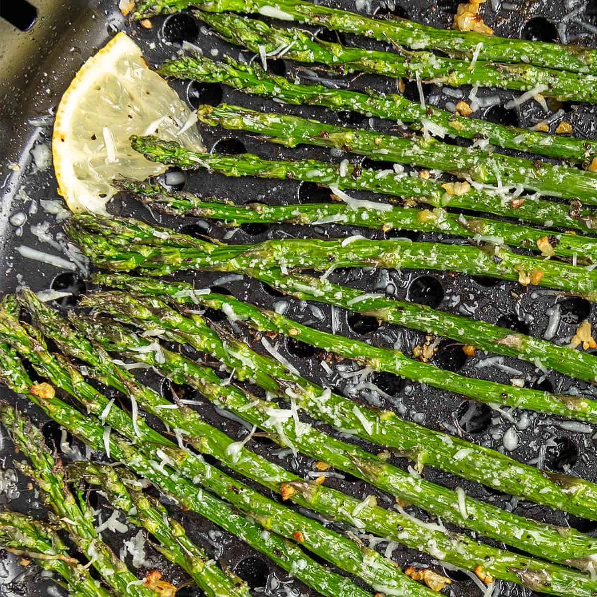 Close up view of air fryer asparagus.