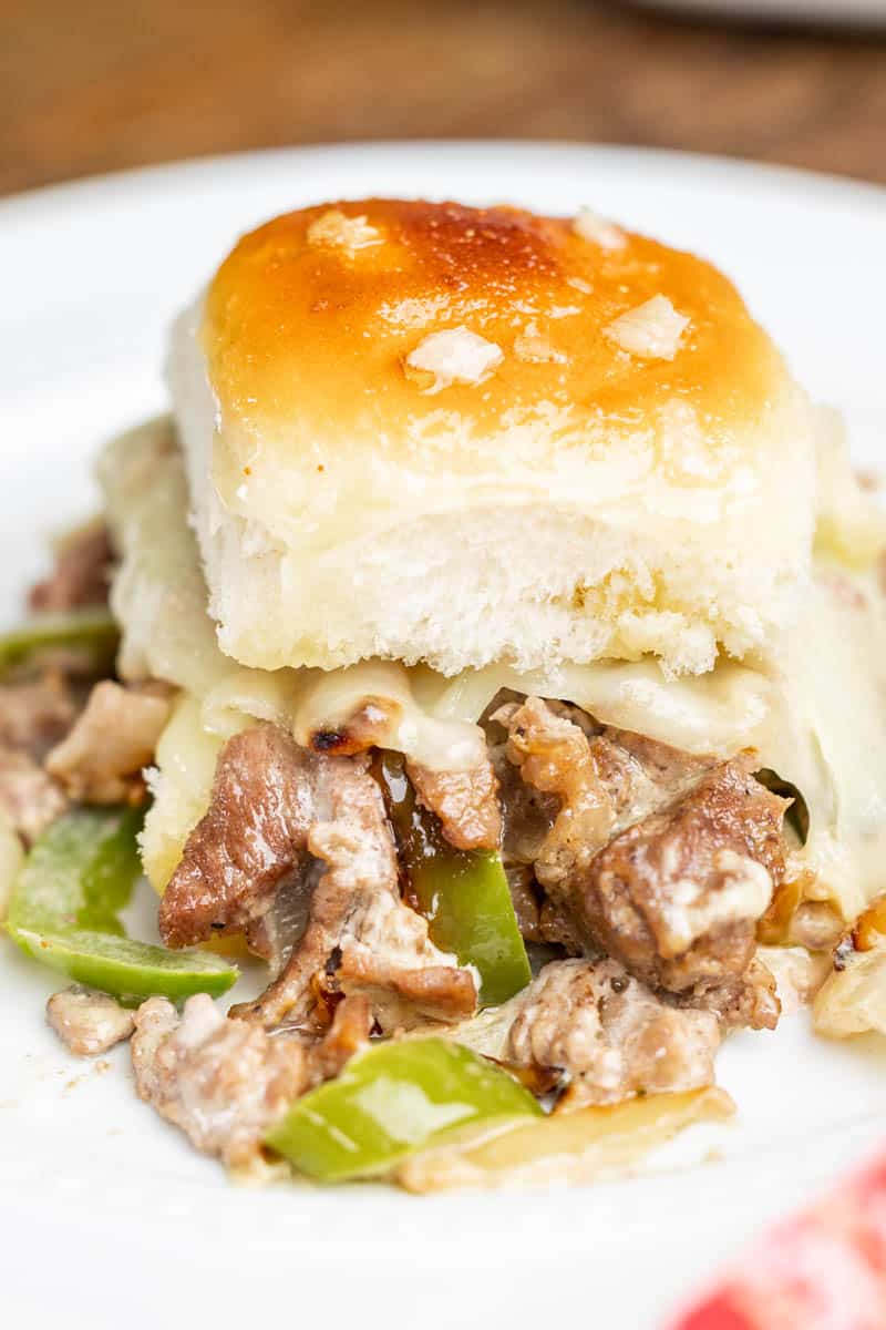 Close up view of cheesesteak sliders.