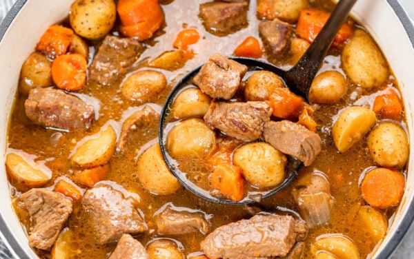 Overhead view looking into a soup pot filled with Irish stew.