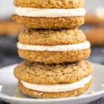 A stack of oatmeal cream pies on a dessert plate.