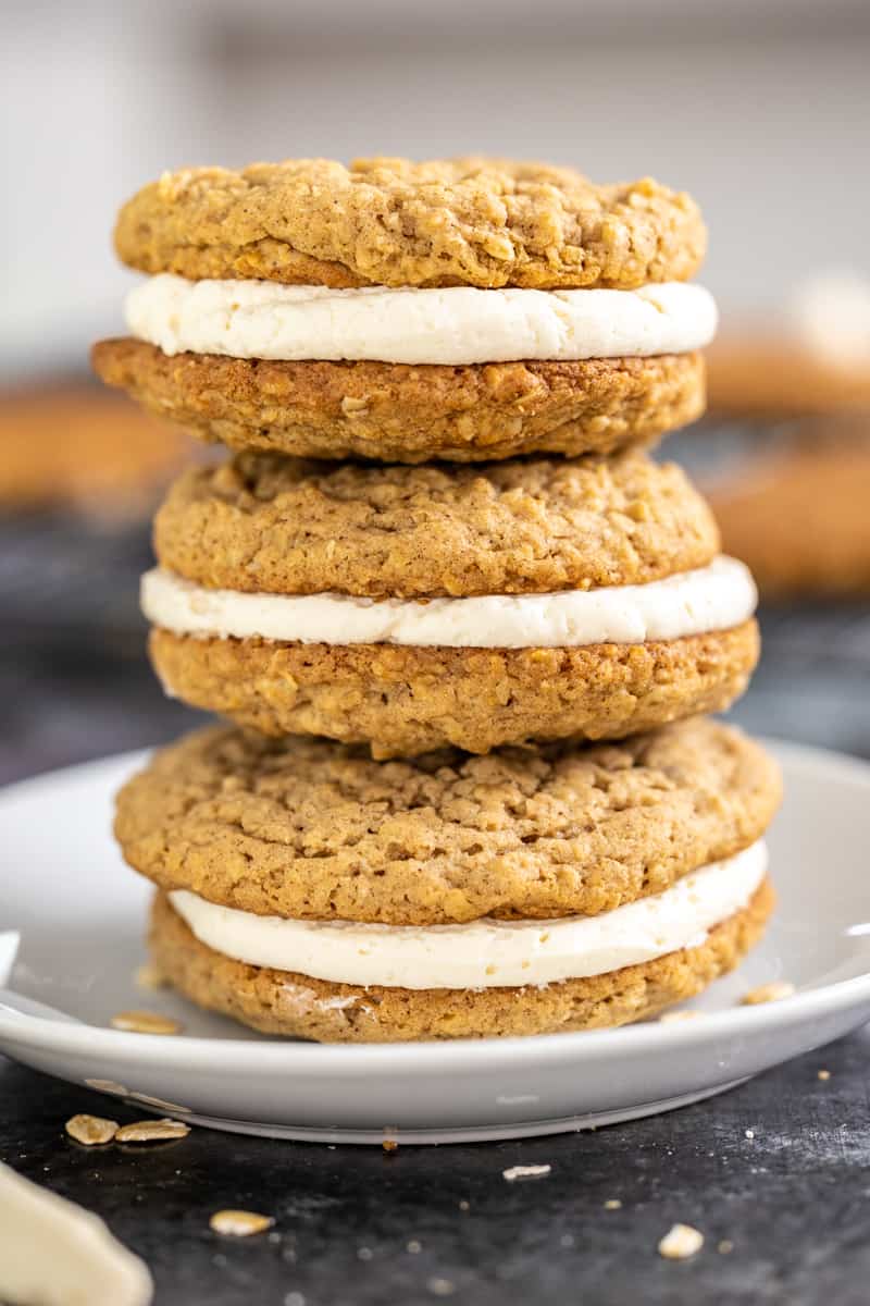 A stack of oatmeal cream pies on a dessert plate.