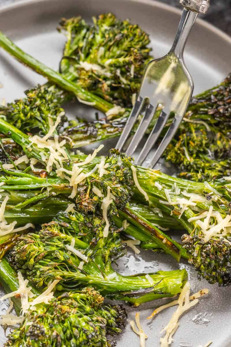 Air fryer broccolini with parmesan cheeses sprinkled on top.