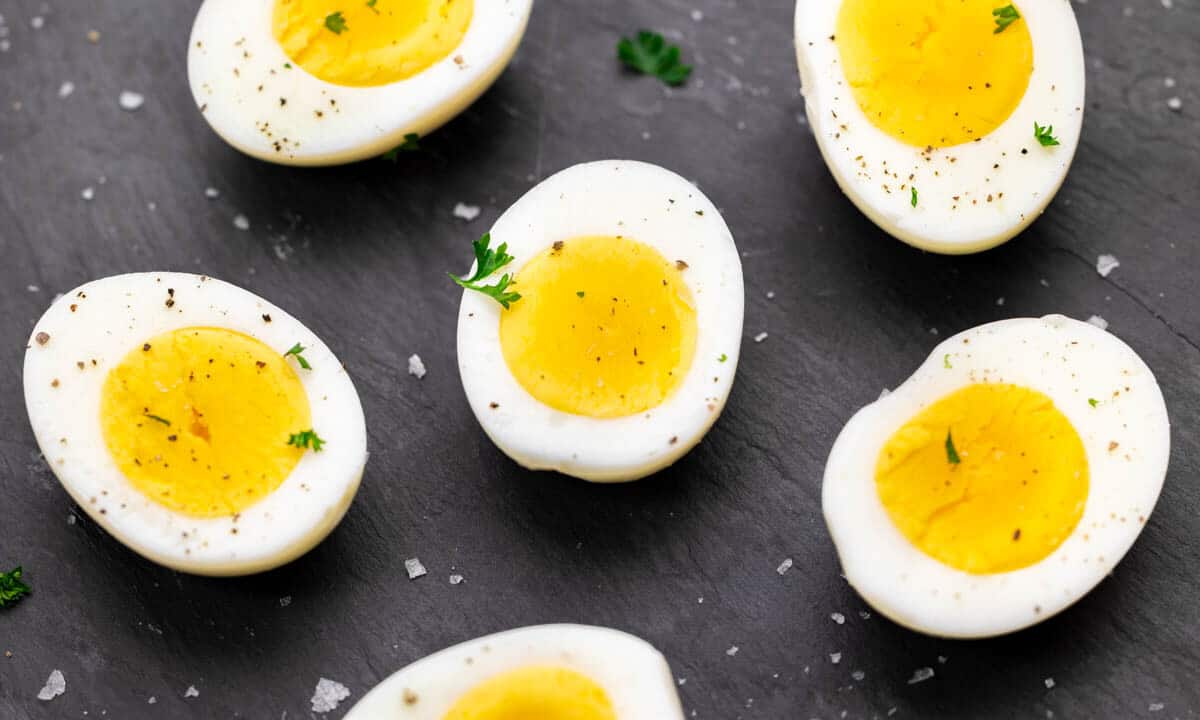 Close up overhead view of hard boiled egg halves.