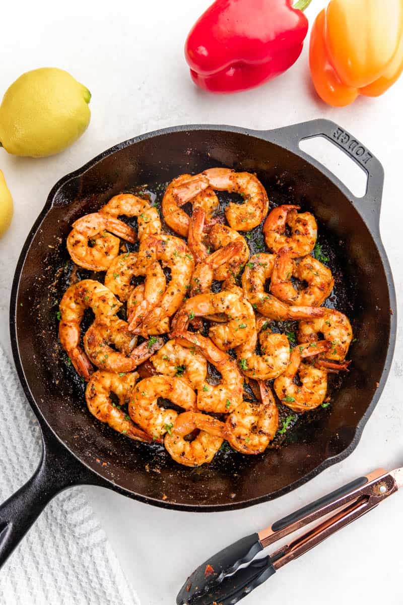 Top view of Cajun shrimp in a cast iron skillet.