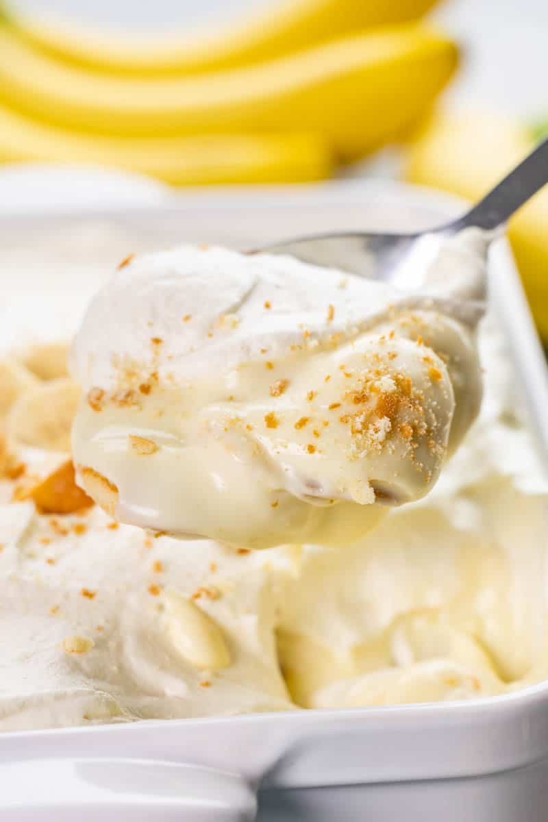 Close up view of a spoonful of banana pudding.