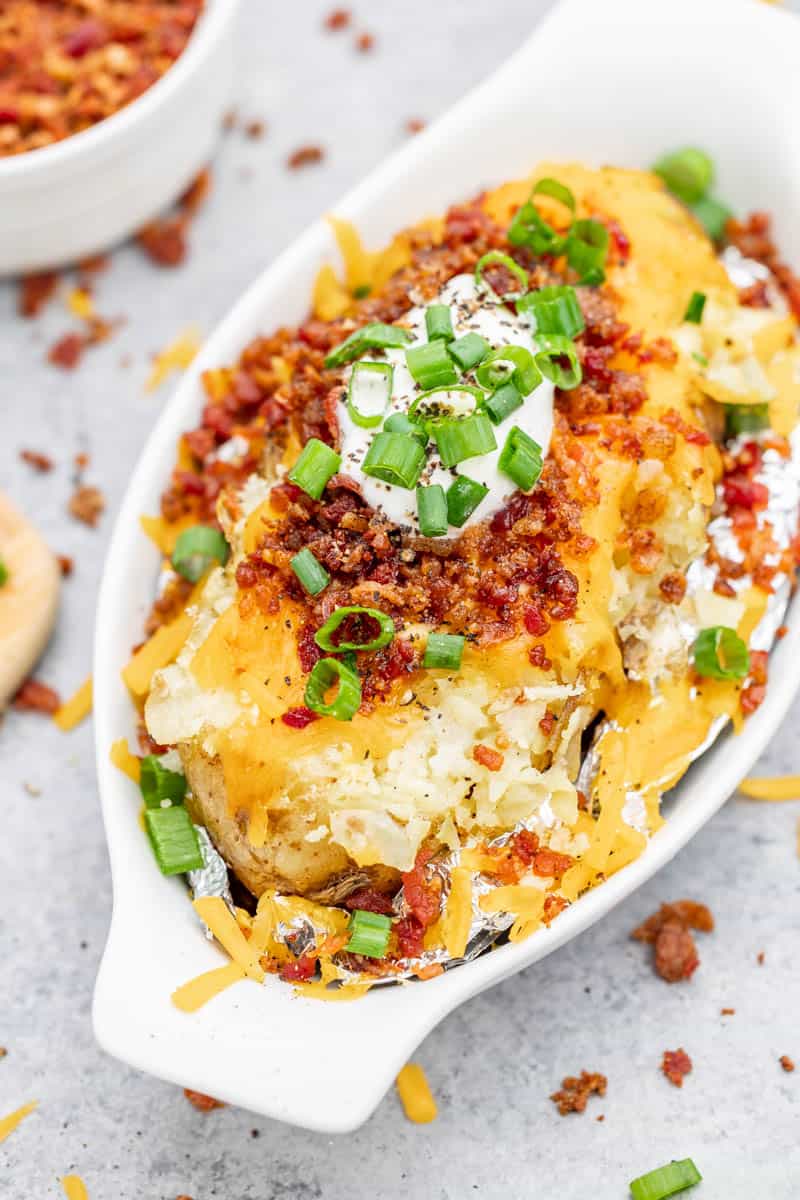 Overhead view of a loaded baked potato.