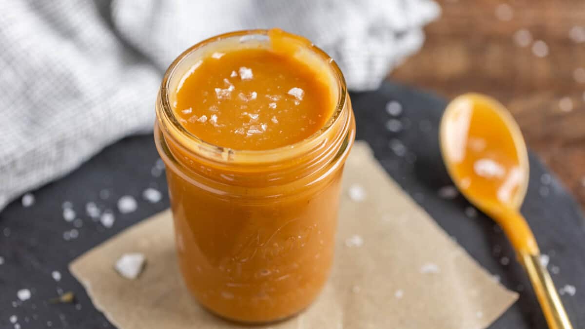 Sea salt caramel sauce in a glass jar.