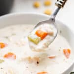 A spoonful of creamy chicken soup.