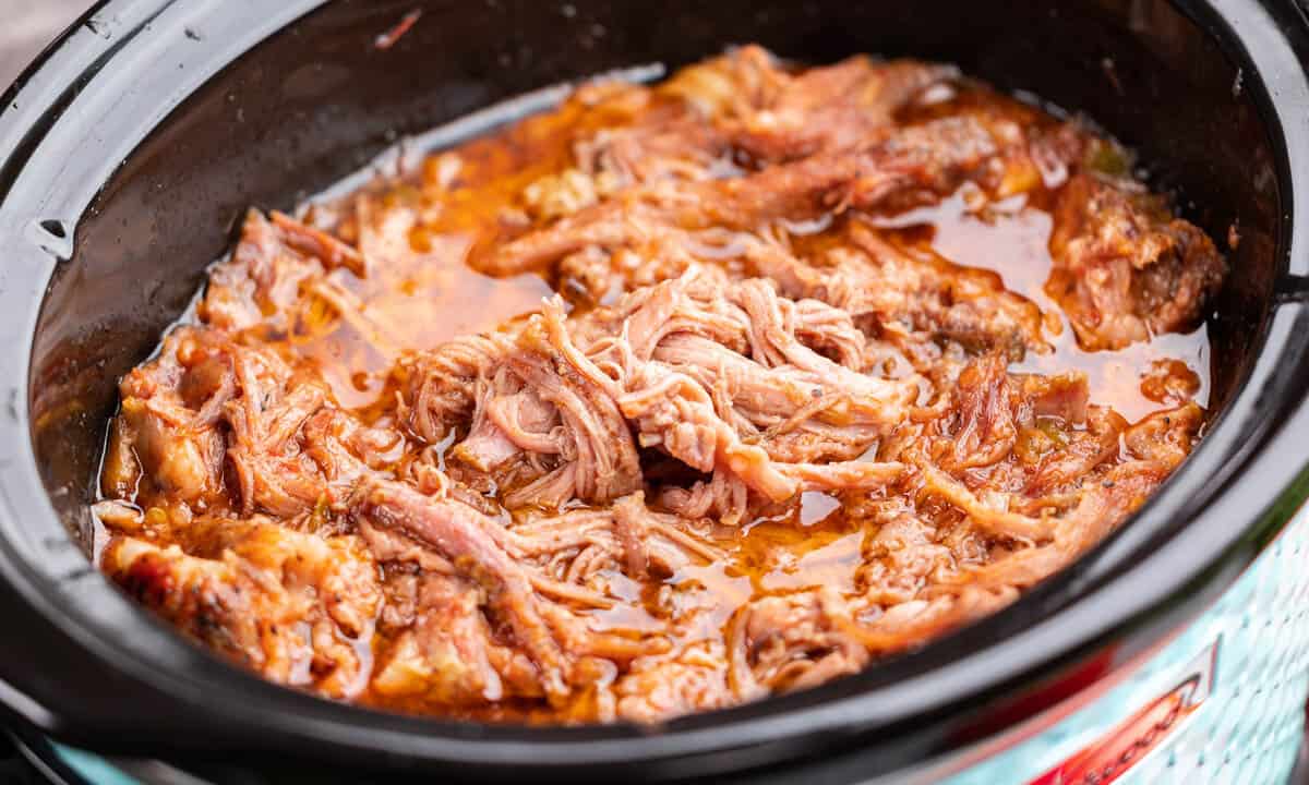 Sweet pulled pork in a slow cooker.