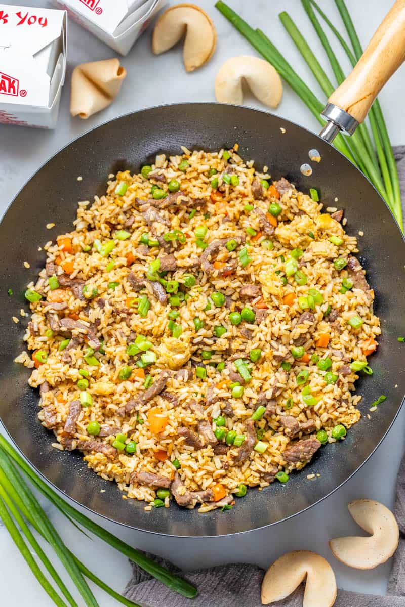 Overhead view of beef fried rice in a wok.