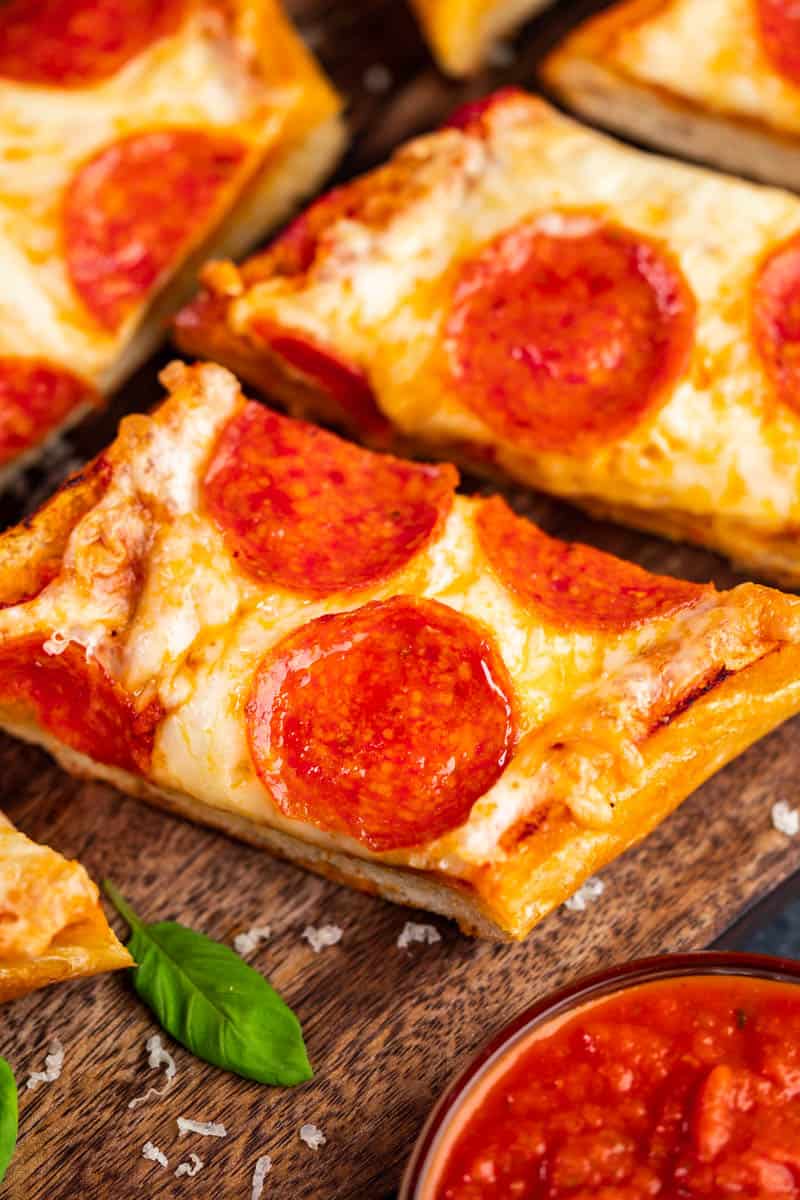 Close-up view of French bread pizza.