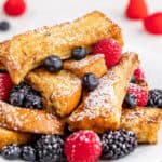 Close up view of french toast sticks on plate.