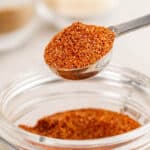 A teaspoon filled with homemade taco seasoning.