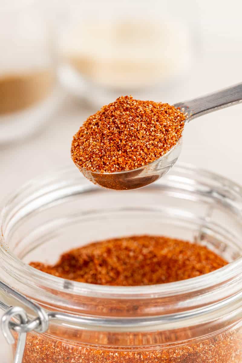 A teaspoon filled with homemade taco seasoning.