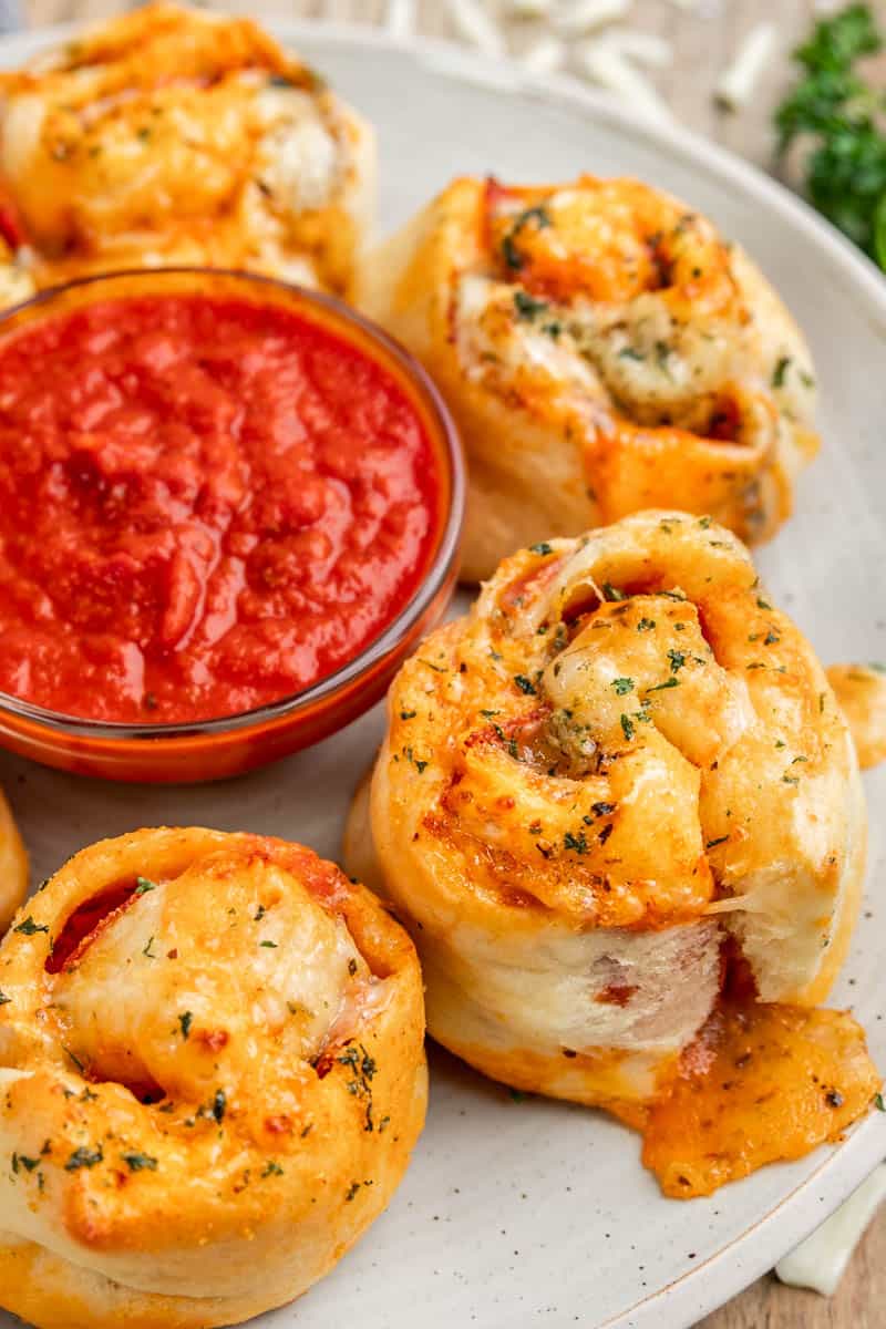 Close up view of pizza rolls and marina sauce for dipping.