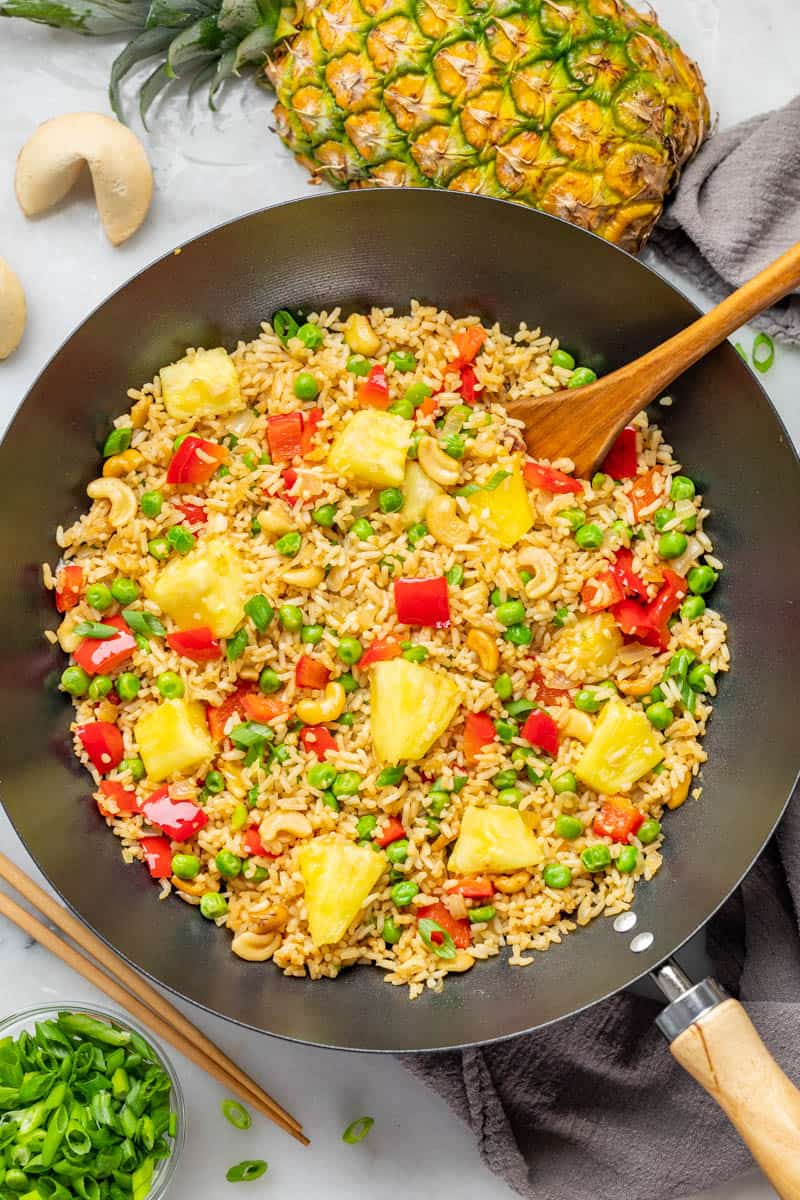 Overhead view of pineapple fried rice in a wok.