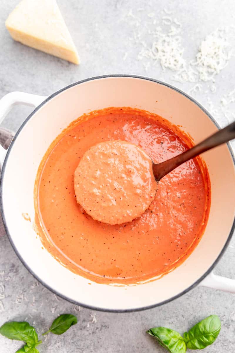 An overhead view looking into a pot of homemade vodka sauce. 